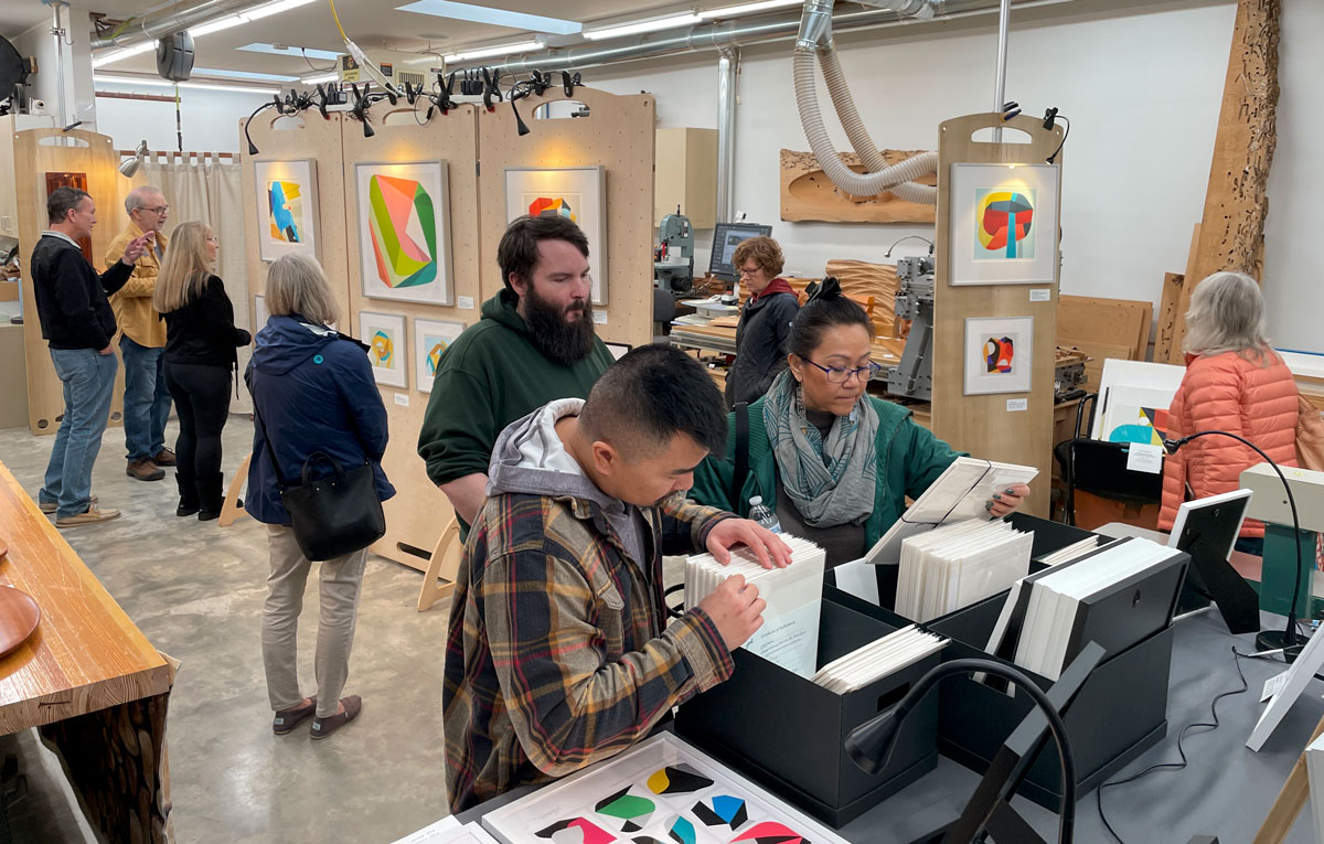Studio visitors browsing artwork